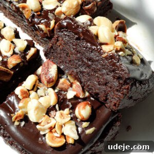 Close-up of rich and fudgy no bake brownies stacked to show ultra fudgy texture