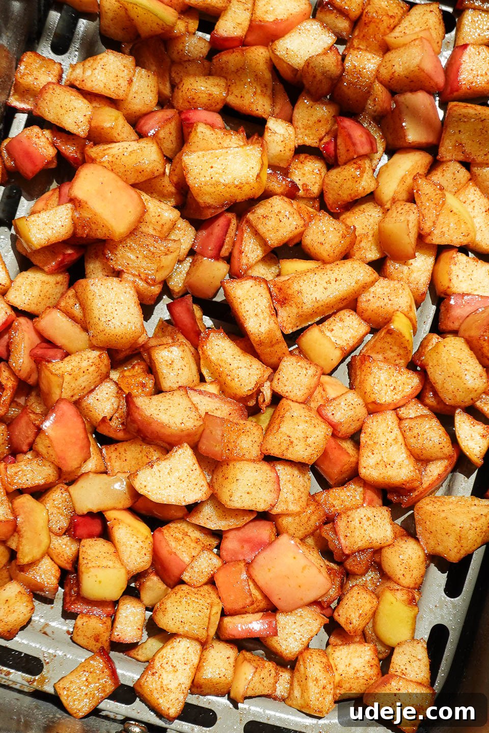 Air Fried Cinnamon Apples 9 Close-up of diced apples cooked in the air fryer until golden and caramelized
