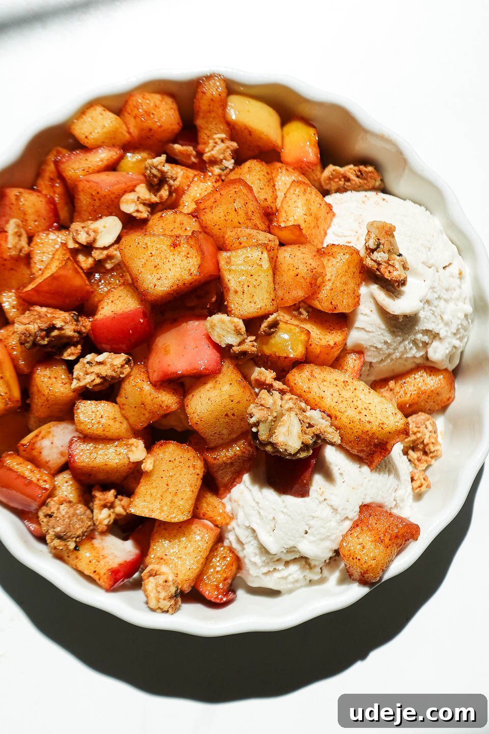 Air Fried Cinnamon Apples 10 Healthy air fryer apples in a ramekin with vegan ice cream and granola on top