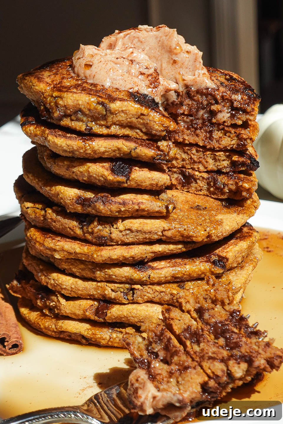 Fluffy Pumpkin Chocolate Chip Pancakes Vegan Gluten-Free 5 Pumpkin chocolate chip pancakes served with maple syrup and a fork on the side