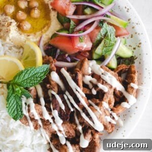 Shawarma plate with hummus, rice, chicken and salad