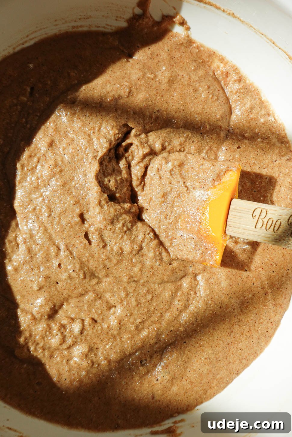 Autumn Spiced Apple Cider Muffins 5 Mixing muffin batter for healthy apple cider muffins