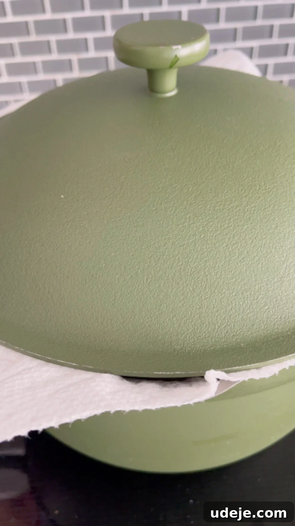 Machboos and Kabsa Aromatic Chicken and Rice 13 a covered large green pot, with a paper towel secured under the lid