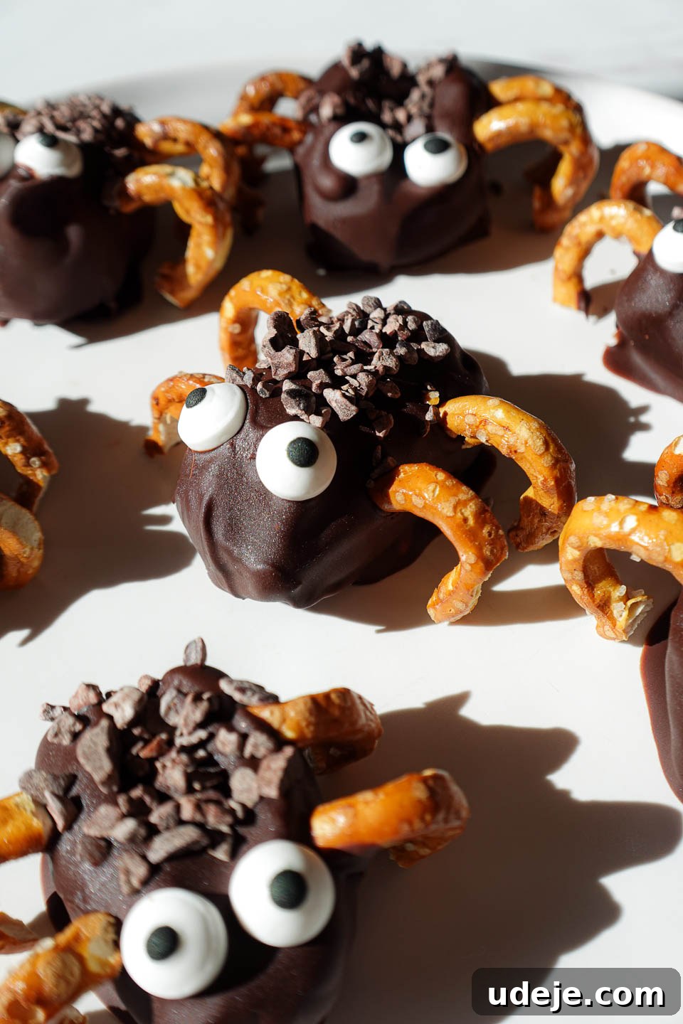 Spooky Stuffed Date Spiders 3 Stuffed date spiders decorated with candy eyes and pretzel legs. A healthy halloween treat!