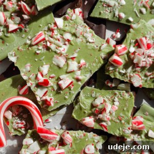 Vegan matcha peppermint bark broken into pieces with candy canes