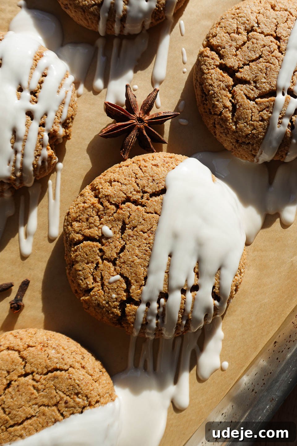 Irresistible Vegan Gluten-Free Gingerbread Chews 2 Close-up of vegan gingerbread cookies with white chocolate drizzle, showcasing their soft texture.