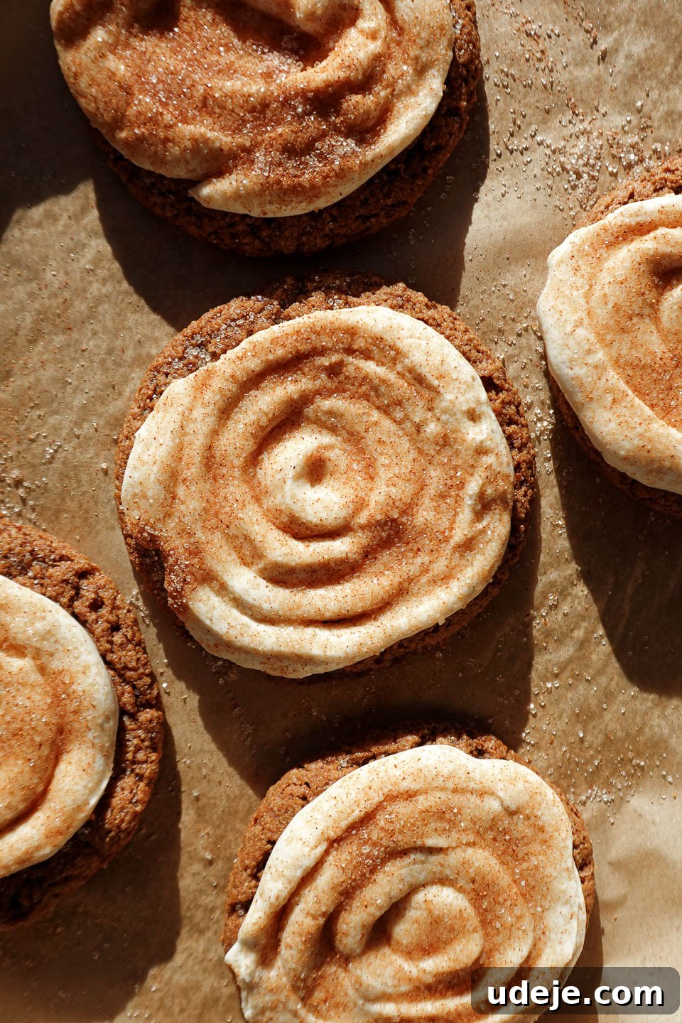 Vegan and gluten-free Crumbl churro cookies topped with creamy swirls and cinnamon sugar