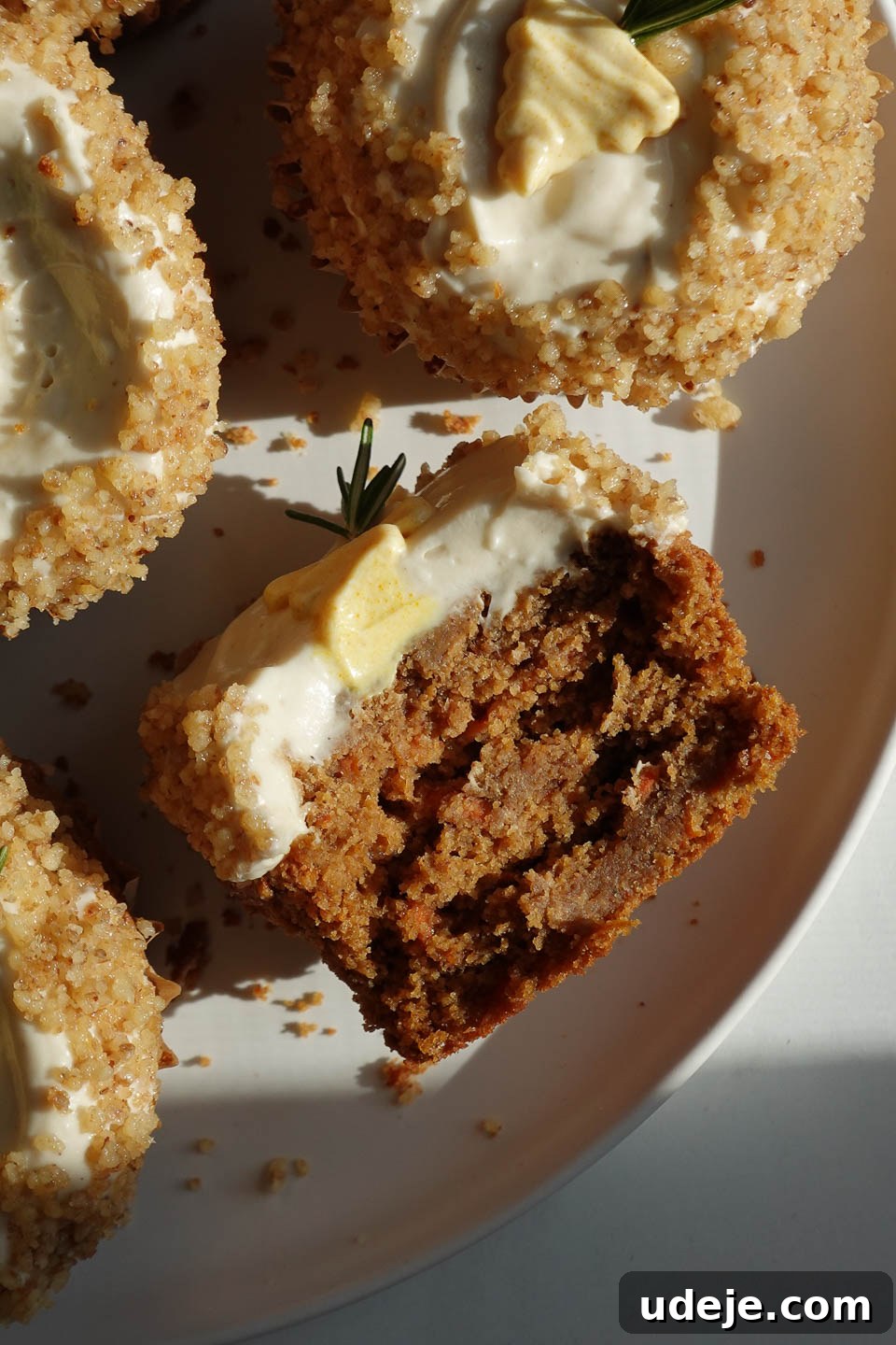Wholesome Vegan Gluten Free Carrot Cake Muffins 5 Inside view of a tender carrot cake muffin made vegan and gluten-free