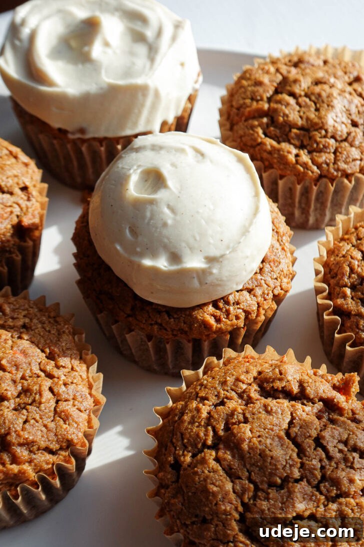 Wholesome Vegan Gluten Free Carrot Cake Muffins 9 Carrot cake muffins topped with cream cheese frosting