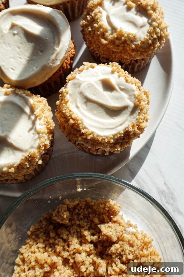 Wholesome Vegan Gluten Free Carrot Cake Muffins 10 Carrot cake muffins decorated with vegan cream cheese frosting and crushed walnuts