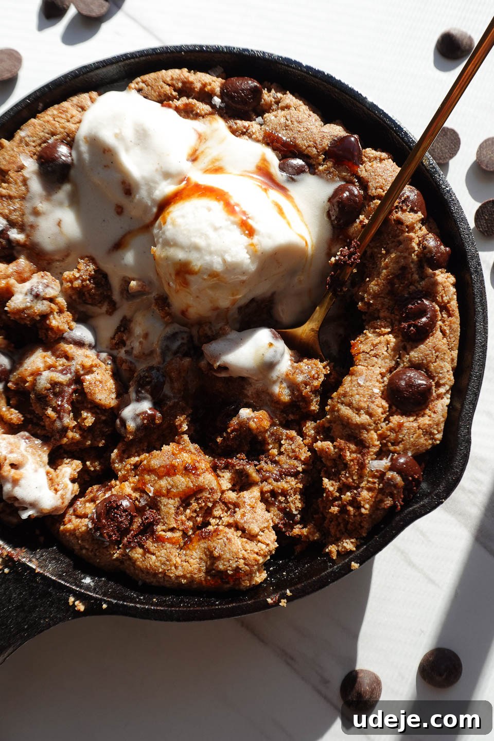 Gooey Skillet Chocolate Chip Cookie Perfection (Vegan and Gluten-Free) 13 Close-up of a soft and chewy chocolate chip skillet cookie with a gooey center, showcasing its inviting texture.