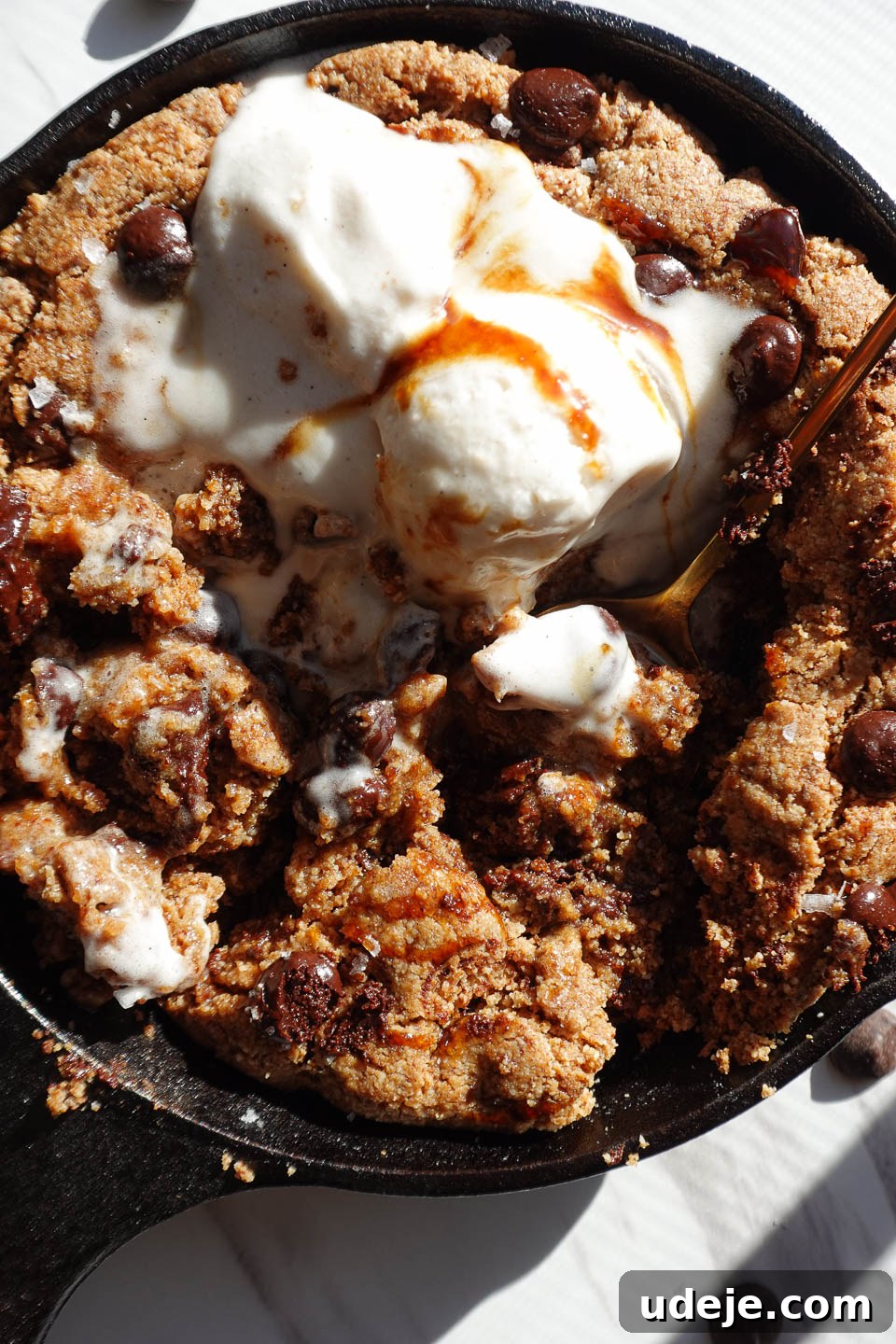 Gooey Skillet Chocolate Chip Cookie Perfection (Vegan and Gluten-Free) 14 Another close-up of a soft and chewy chocolate chip skillet cookie with a gooey center, emphasizing its decadent appeal.