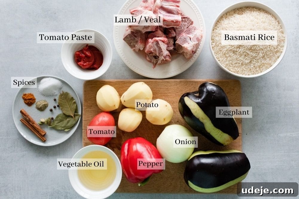 The Perfect Upside-Down Lamb Maqluba (Makloubeh) 3 Ingredients for Maqluba laid out: eggplant, onion, bell pepper, potato, tomato, vegetable oil, various whole spices, tomato paste, lamb pieces, and basmati rice.