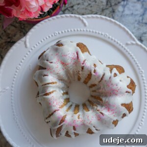Close-up of a slice of Vegan Vanilla Bundt Cake, showing its moist texture