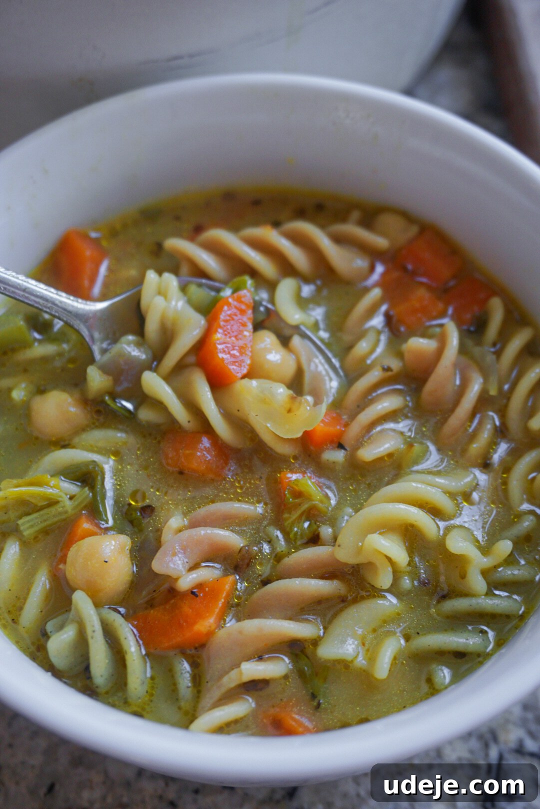 Hearty Chickpea Noodle Medley 3 Close-up of Chickpea Noodle Soup simmering in a large pot