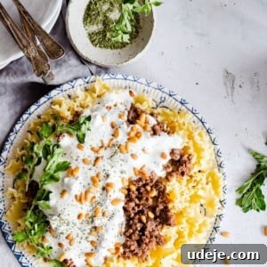 Arabic pasta served on a plate garnished with nuts and fresh herbs