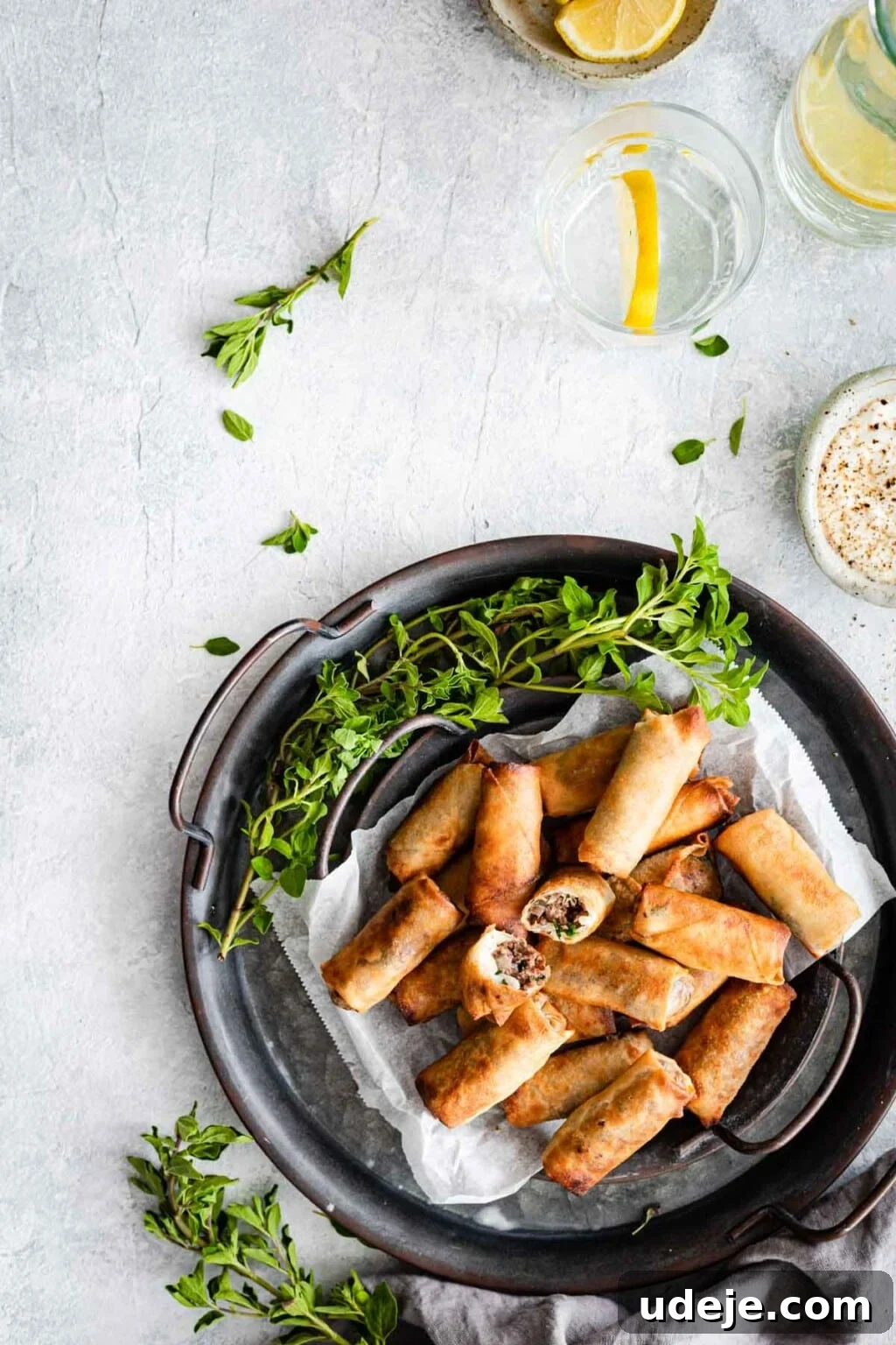 Your Guide to Authentic Homemade Sambousek 2 Sambousak served on a plate garnished with greens