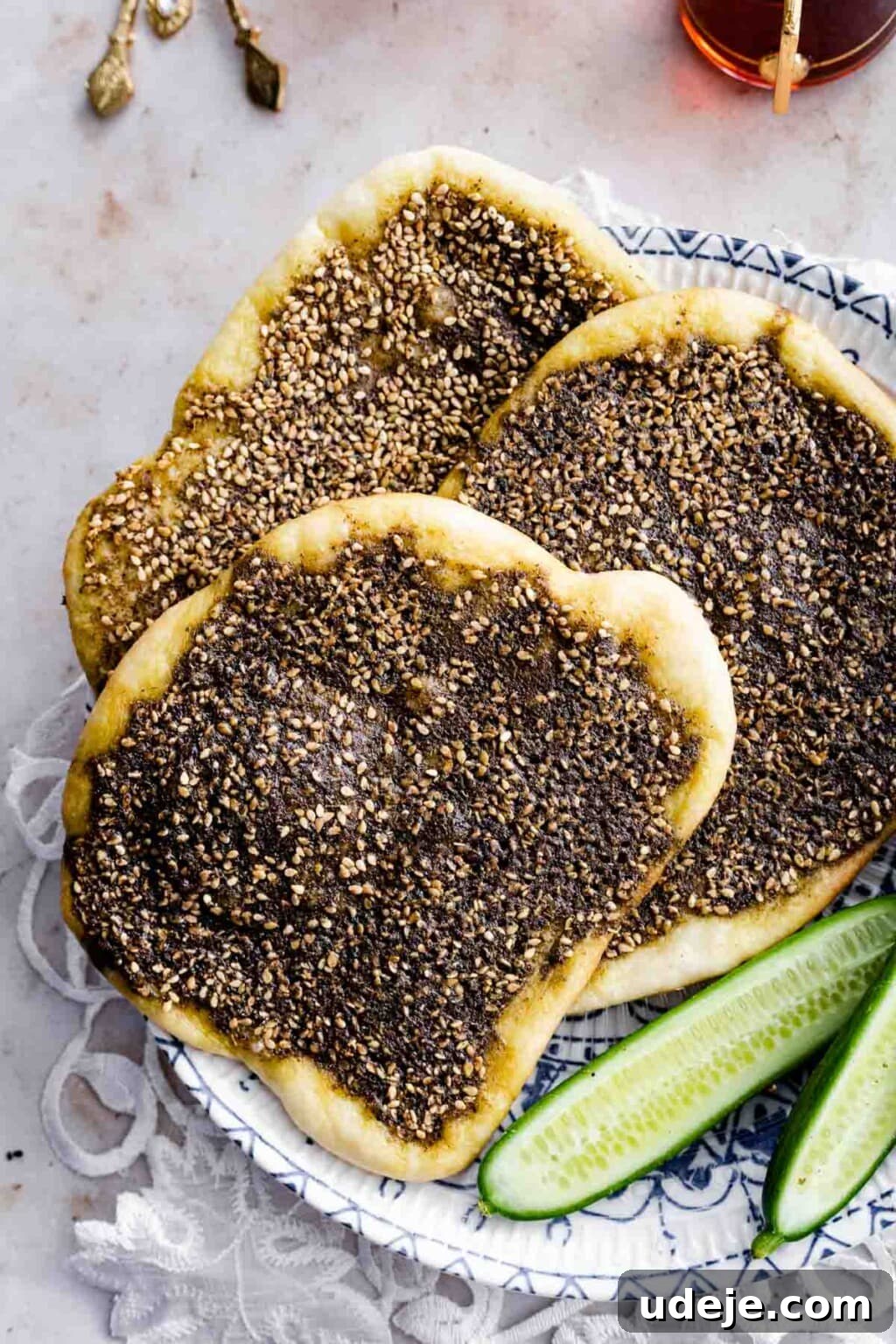 Homemade Cheese and Zaatar Manakish 3 Za'atar Manakish served with some cucumber slices on the side