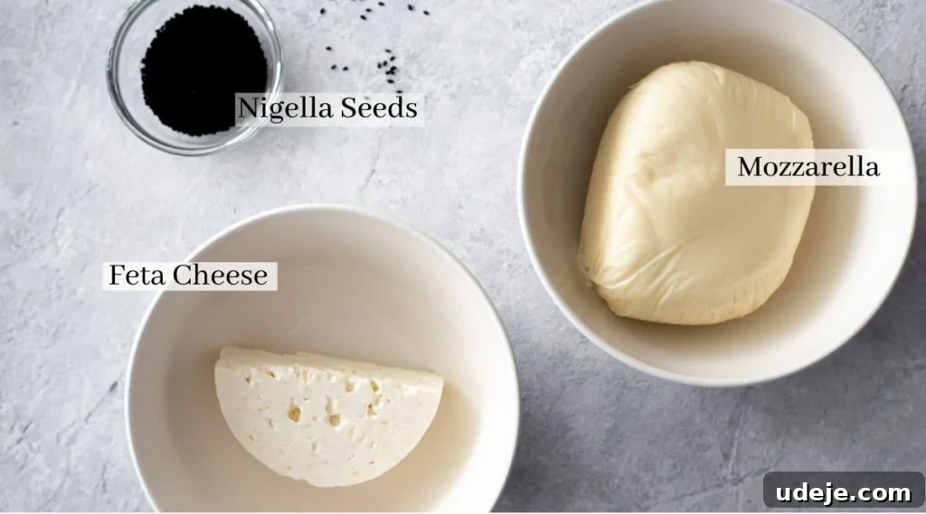Homemade Cheese and Zaatar Manakish 5 ingredients for cheese topping: feta cheese, mozzarella cheese and nigella seeds