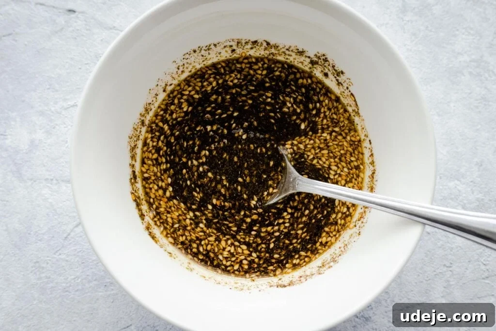 Homemade Cheese and Zaatar Manakish 7 za'atar mixed with olive oil in a bowl, ready to be spread