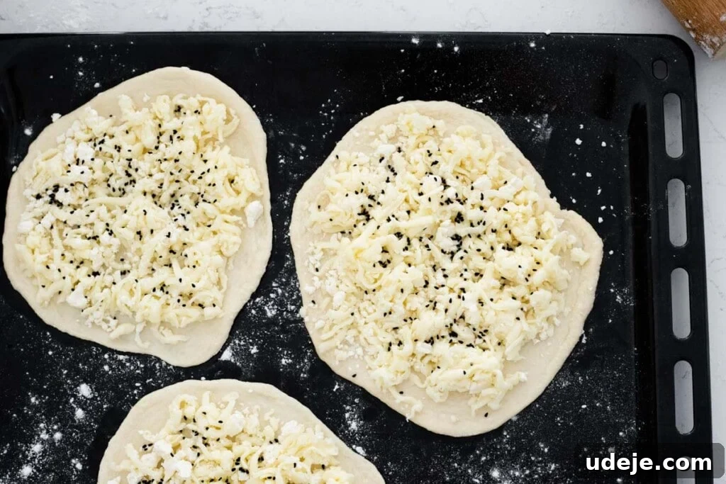 Homemade Cheese and Zaatar Manakish 10 cheese manakish freshly baked and still on a baking tray