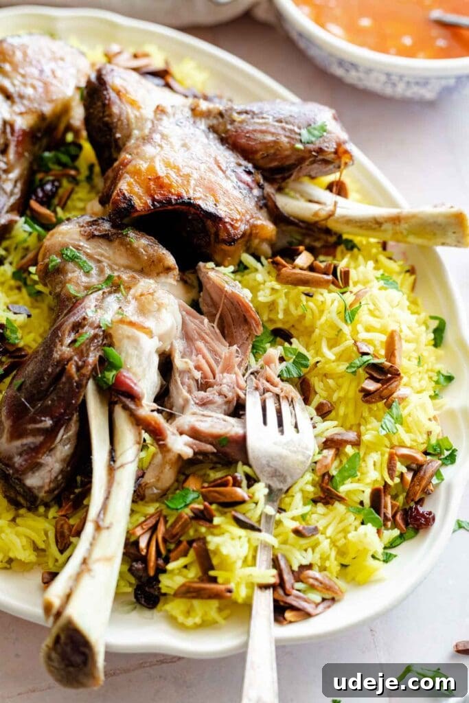Authentic Iraqi Quzi: Slow-Cooked Lamb on Aromatic Rice 8 Quzi which is lamb shanks served over yellow rice with almonds and raisins