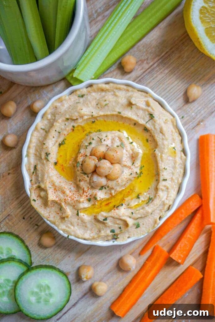 Effortlessly Craft Your Own Hummus 2 Easy Homemade Hummus: Incredibly smooth, creamy, and bursting with flavor. Made with simple ingredients in only 10 minutes!
