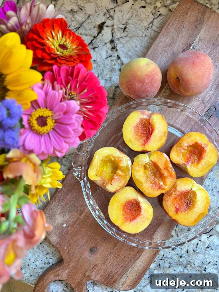 Golden Baked Peaches 3 Close-up of golden-brown baked peaches, showing their soft, caramelized texture, perfect for a summer dessert.