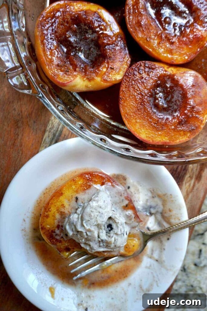 Golden Baked Peaches 5 A serving bowl of warm baked peaches with a melting scoop of vegan vanilla ice cream and crunchy walnuts.