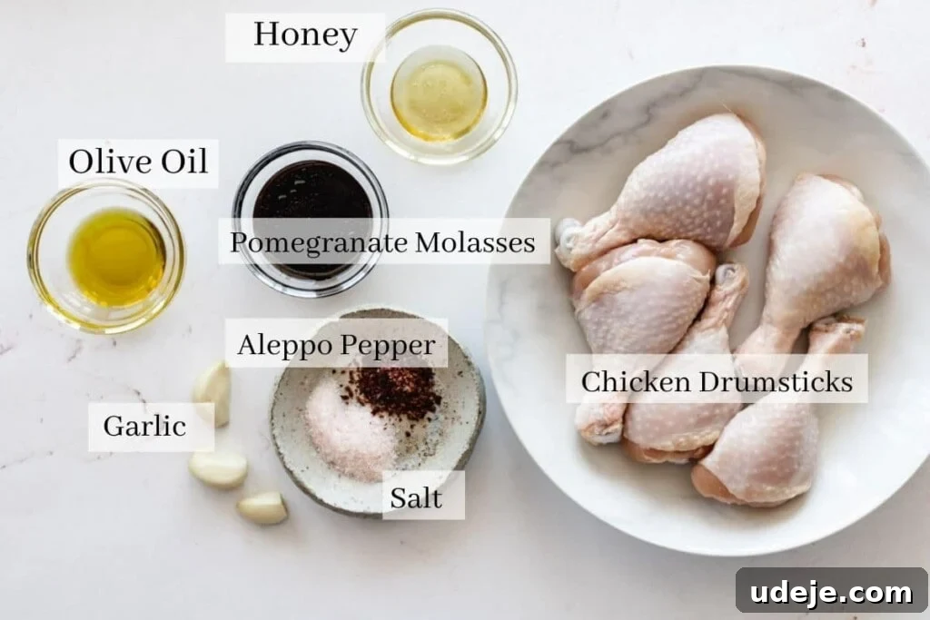 Sticky Pomegranate Air Fryer Drumsticks 3 Ingredients for pomegranate molasses glaze including a bowl of molasses, garlic, and spices