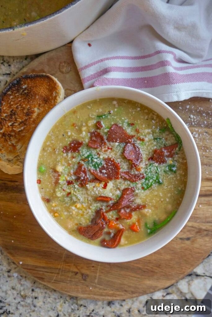 A comforting bowl of Potato, Leek & White Bean Soup, made with hearty plant-based ingredients.