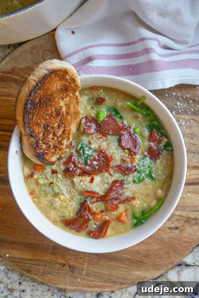 A close-up of the delicious, creamy Potato, Leek & White Bean Soup.
