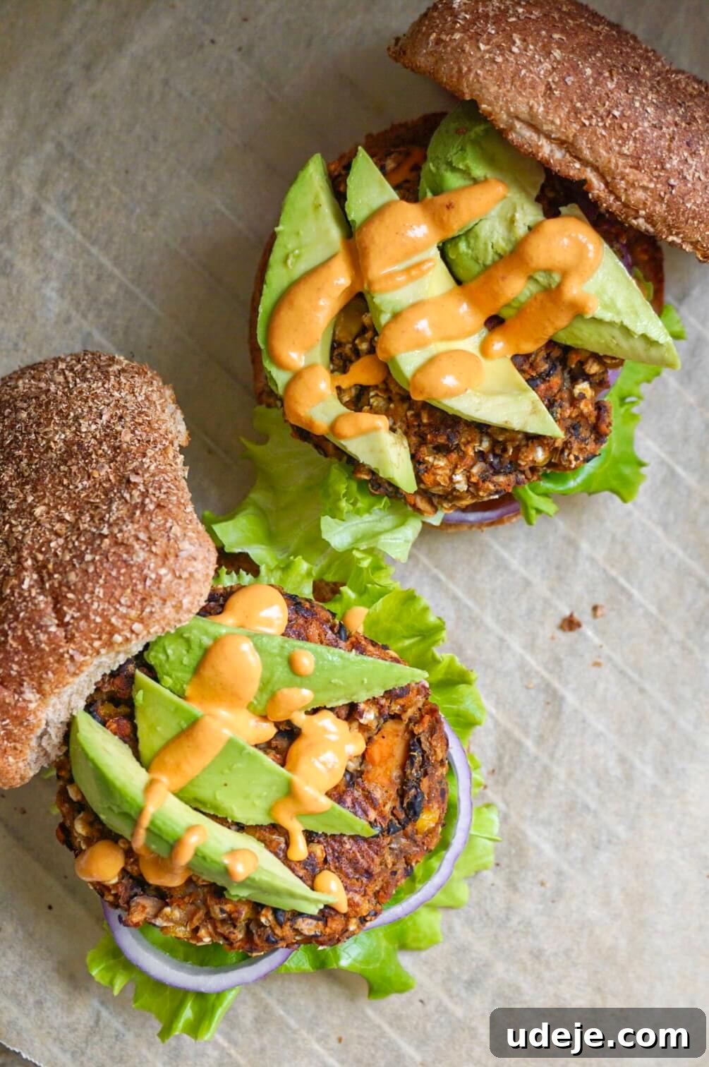 Wholesome Black Bean Sweet Potato Burgers 2 Delicious homemade Black Bean and Sweet Potato Veggie Burgers, stacked high with fresh toppings.