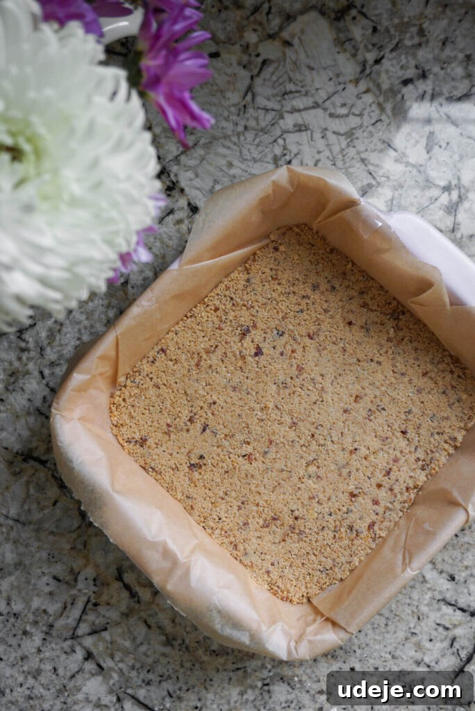 Plant-Based Caramel Cookie Delight 3 Layers of almond flour base and date caramel before chocolate coating for Vegan Twix Bars.