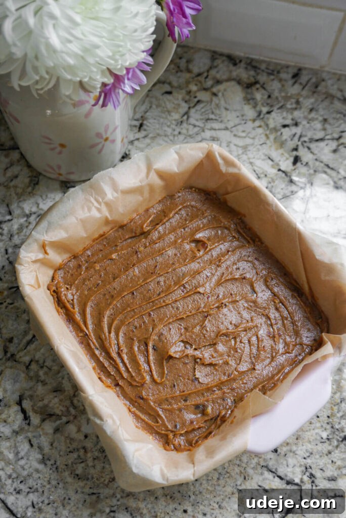 Plant-Based Caramel Cookie Delight 4 Close-up of the date caramel layer in Vegan Twix Bars.