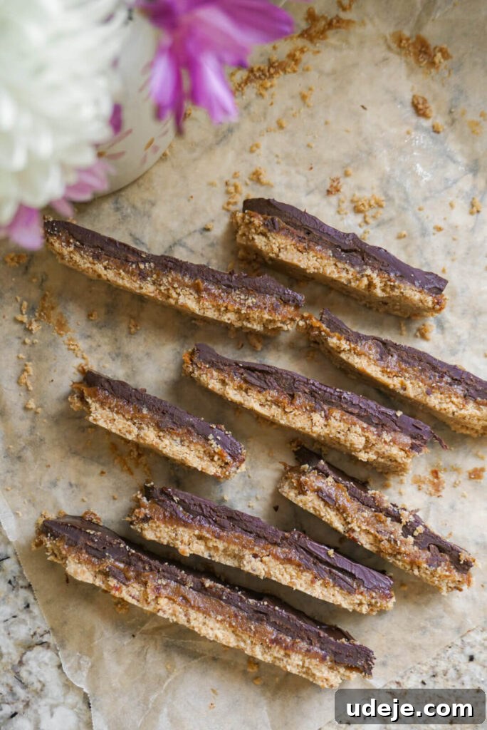 Plant-Based Caramel Cookie Delight 6 Finished Vegan Twix Bars on a cooling rack, ready to be enjoyed.