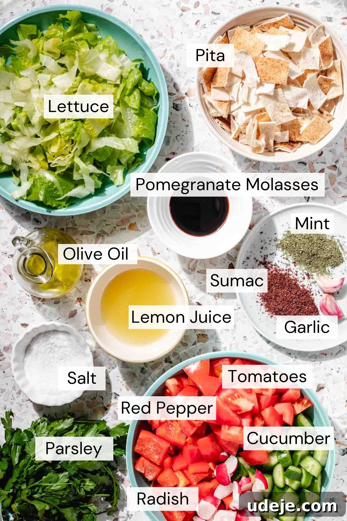 Signature Restaurant Fattoush 3 Fattoush salad ingredients in separate bowls and plates, which include: lettuce, pita bread, pomegranate molasses, olive oil, lemon juice, sumac, dried mint, garlic, salt, parsley, red pepper, tomatoes, cucumber and radish.