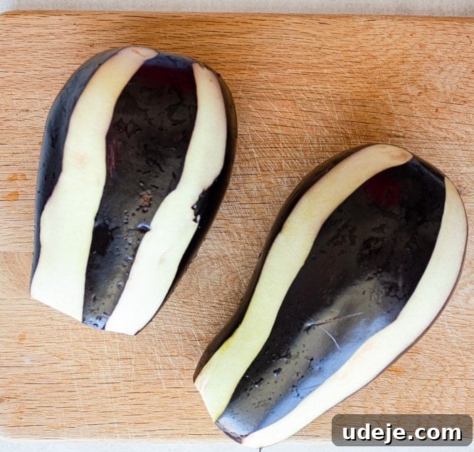 Regal Stuffed Eggplant and Onions 7 Eggplant peeled in a stripe pattern, showcasing the zebra peeling technique.