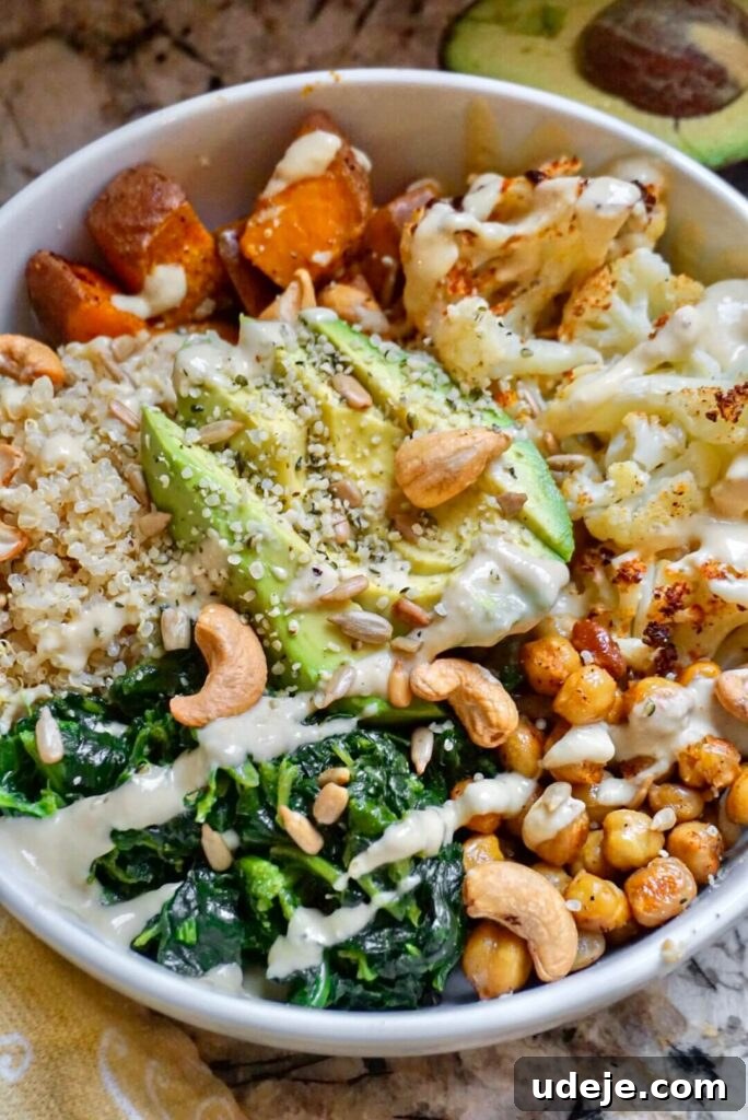 Roasted Sweet Potato, Cauliflower and Chickpea Buddha Bowls 3 Close-up of roasted sweet potatoes, cauliflower, and chickpeas