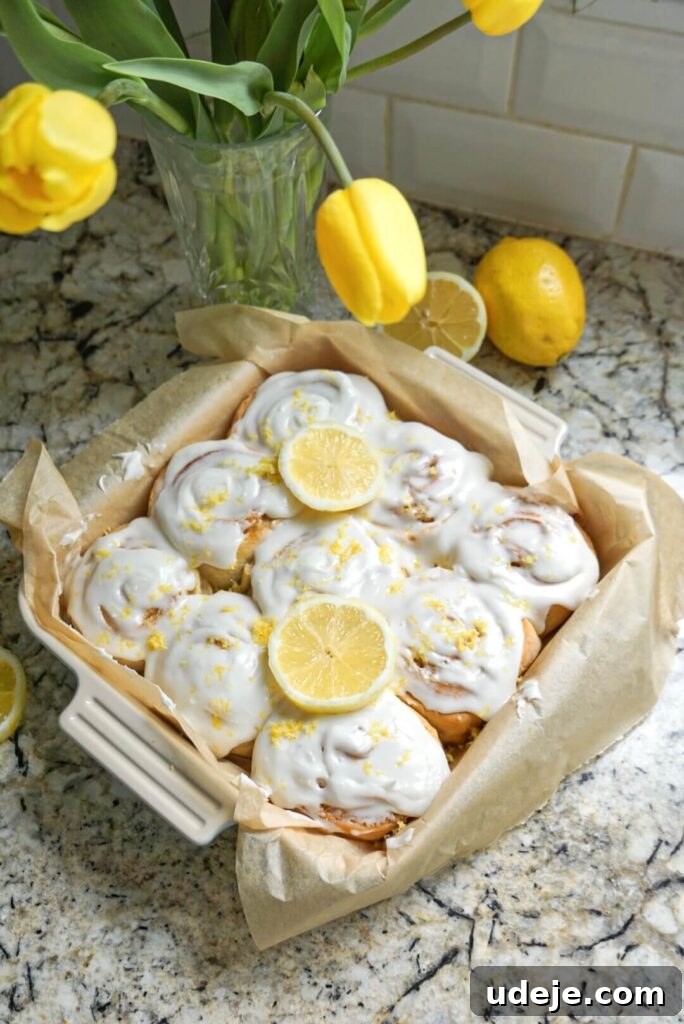 Zesty Vegan Lemon Rolls 4 A spread of delicious Vegan Lemon Sweet Rolls, individually baked and generously frosted, ready for a spring gathering.