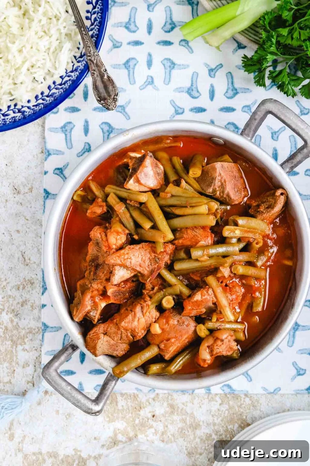 Effortless Green Bean Stew Instant Pot and Stovetop 2 middle eastern green bean stew with tender veal and vibrant green beans served over fluffy basmati rice in a rustic setting