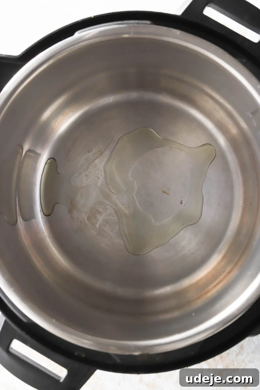Effortless Green Bean Stew Instant Pot and Stovetop 5 olive oil heating in an Instant Pot before searing meat