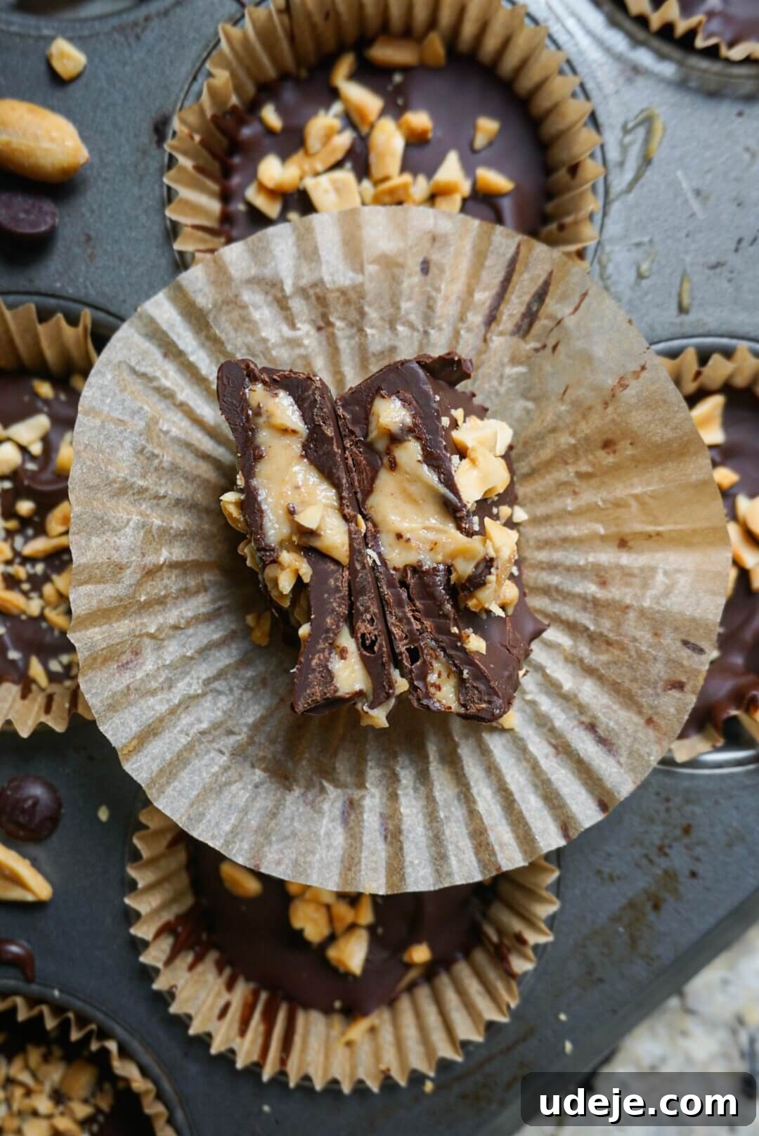 Dreamy Vegan Chocolate Peanut Butter Yogurt Bites 4 Ingredients for Vegan Chocolate Peanut Butter Yogurt Cups laid out on a table: non-dairy yogurt, peanut butter, maple syrup, vanilla extract, vegan chocolate chips, and coconut oil.