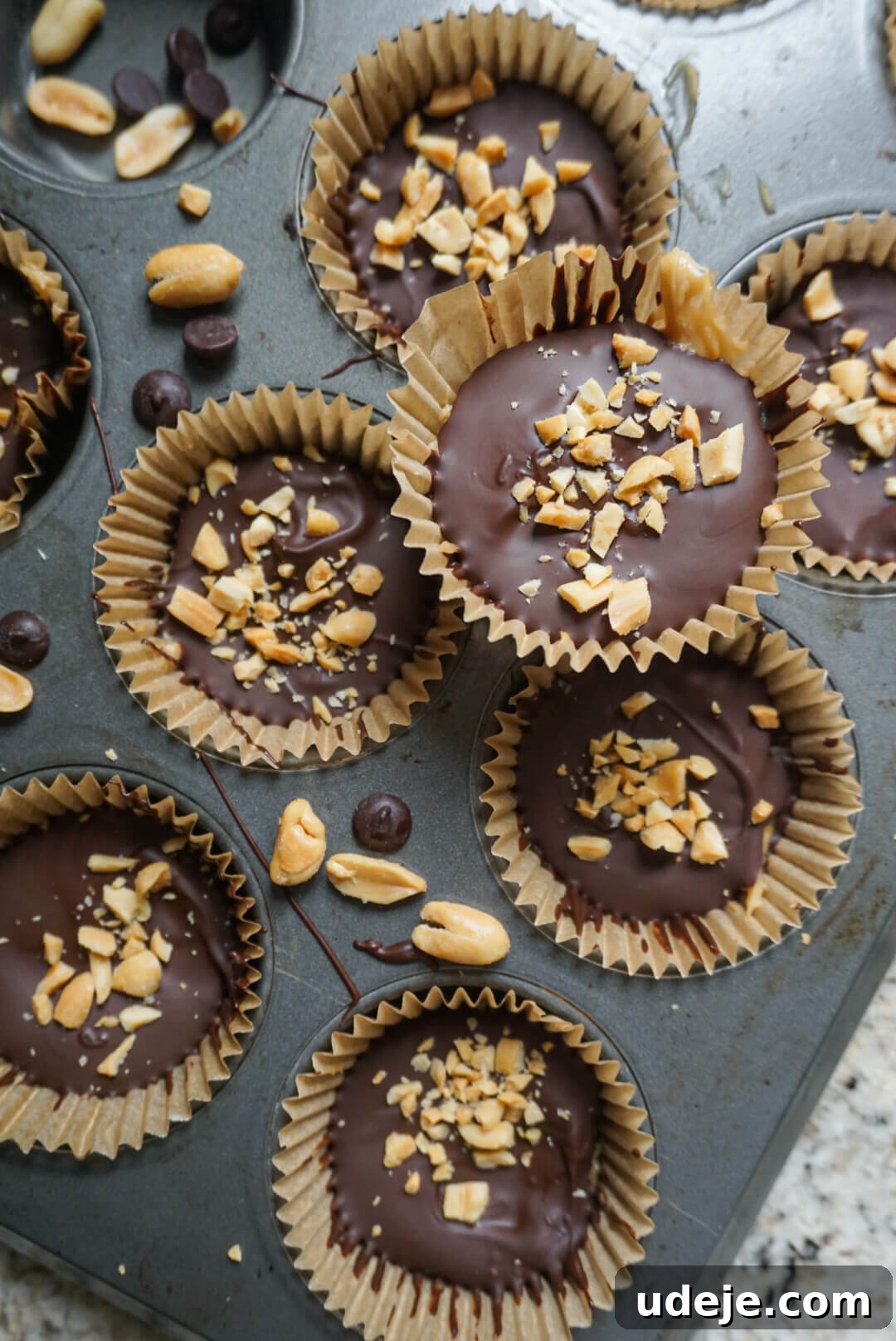 Dreamy Vegan Chocolate Peanut Butter Yogurt Bites 5 Finished Vegan Chocolate Peanut Butter Yogurt Cups, removed from liners and stacked, ready to eat. They are a healthy, no-bake, and delicious summer treat.
