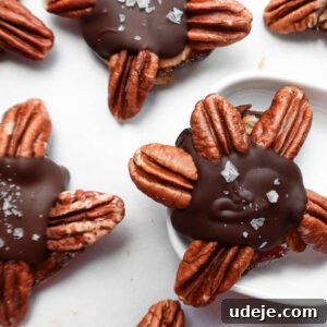 Finished healthy chocolate turtles made with just four ingredients arranged on a baking sheet, showcasing their delicious appeal.