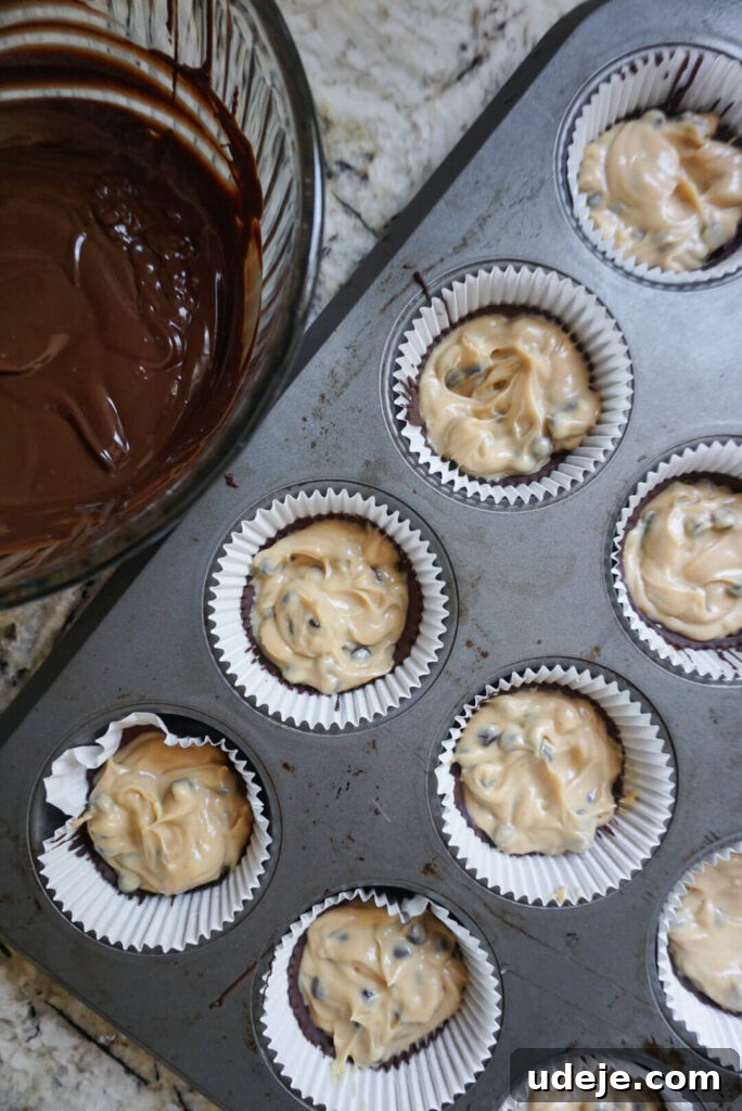 A close-up view of a Vegan Chocolate Chip Cookie Dough Yogurt Cup, showcasing the creamy filling and chocolate coating.
