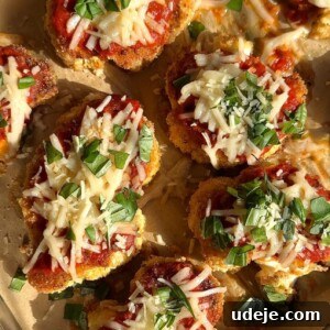 Vegan Cauliflower Parmesan dish with melted cheese and fresh basil