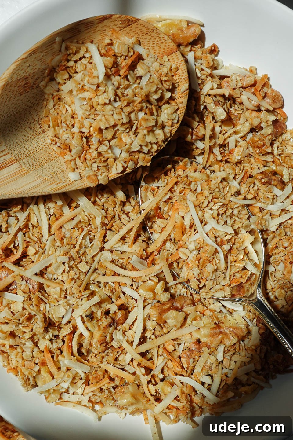 Simply Delicious Five Ingredient Healthy Granola 3 Close-up view of crunchy 5-ingredient homemade granola clusters in a bowl, ready to be enjoyed.