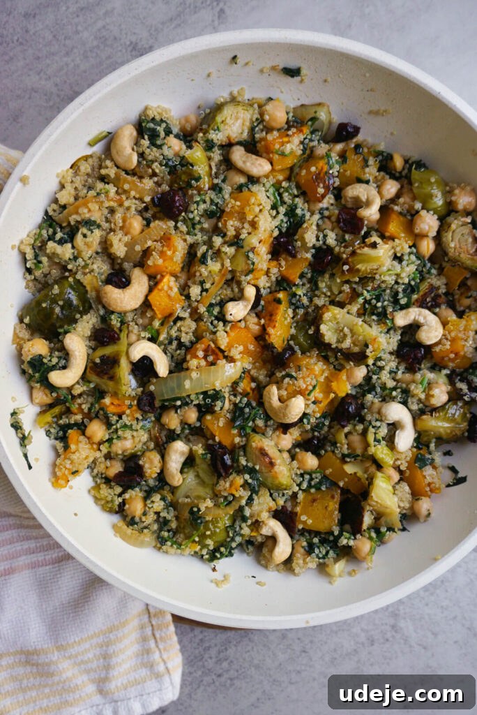 Close-up of a Fall Harvest Quinoa Bowl showcasing roasted butternut squash, brussels sprouts, and caramelized onions.