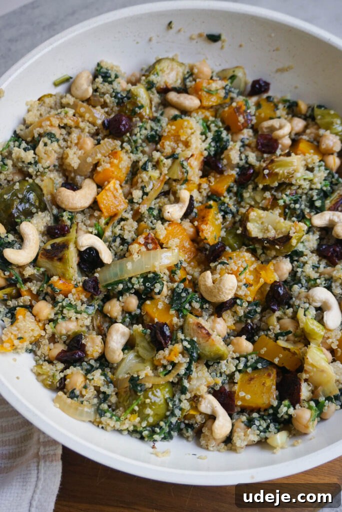 A beautifully presented Fall Harvest Quinoa Bowl ready to be enjoyed, highlighting its rich textures and colors.